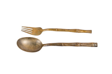 old brass spoon and fork isolated on white background