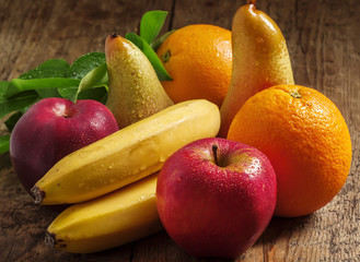 Colored fruits: apple, banana, orange, pear, selective focus