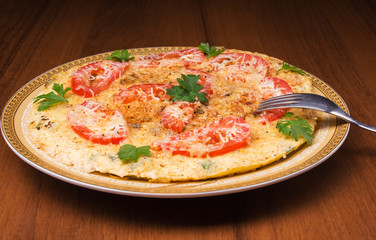 Omelet with cauliflower, tomatoes, fresh herbs and cheese