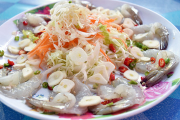 Shrimp in fish sauce with chilli and garlic on dish.