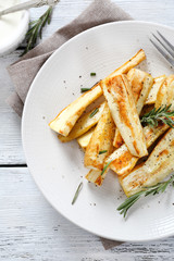 Baked parsnips on plate