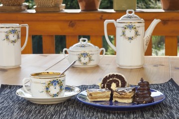 dessert with coffee, chocolate cakes and rolls
