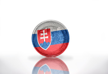 Naklejka premium euro coin with slovak flag on the white background