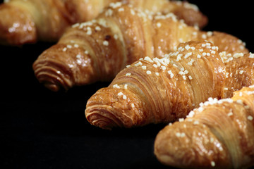 Croissant sprinkled with white chocolate