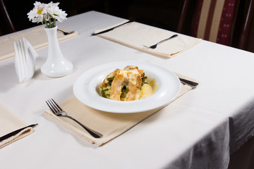 Prepared Dish at Place Setting on Restaurant Table