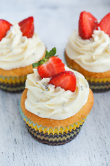 Delicious cream and strawberry cupcake