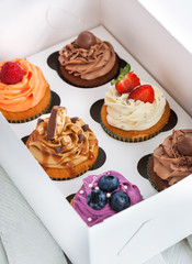 Set of different  cupcakes in a box