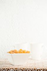 Candy ginger in white porcelain bowl