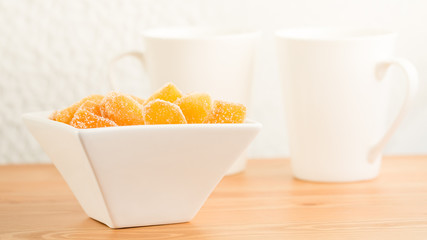 Candy ginger in white porcelain bowl