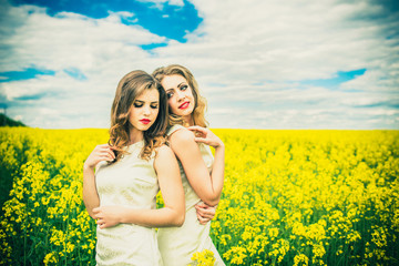 Pretty girls outdoor walking in the field