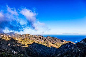 Clouds and mountain with blue sky horizon