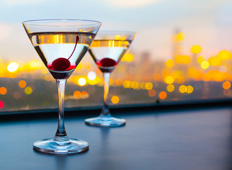 Cocktail glasses with city view