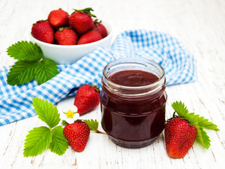 Strawberry jam and fresh strawberries