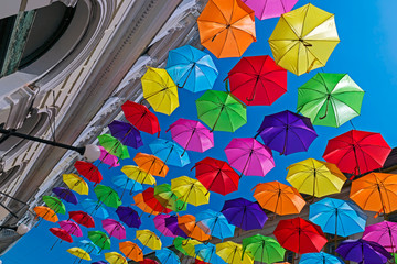 Fototapeta na wymiar Street decorated with colored umbrellas 2