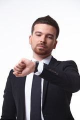 businessman looks at the clock