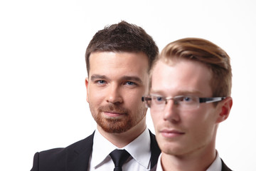close-up portrait of two young businessmen