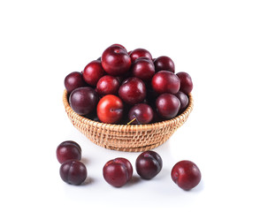 Basket full of fresh ripe cherry on a white background