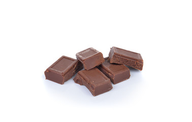 chocolate pieces on white background