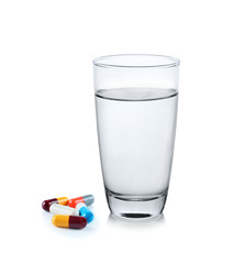 glass of water with pill capsule