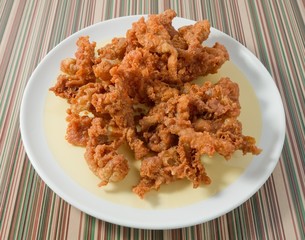Thai Street Food Deep Fried Chicken Skins on A Dish
