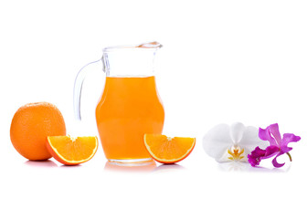 Orange juice in pitcher with orange. Isolated on white backgroun