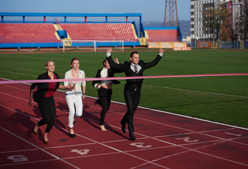business people running on racing track