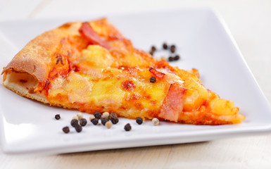 Delicious italian pizza served on white plate