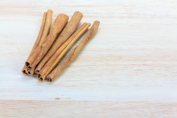 Close up cinnamon stick on wooden background