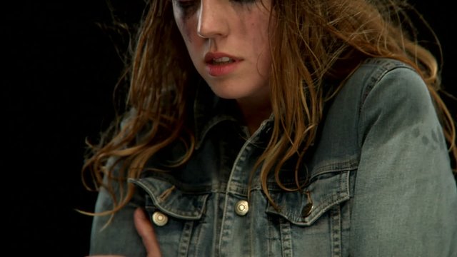 A  young white woman is cold and shivering