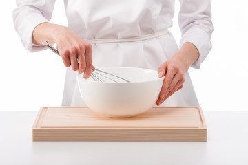 Cook whips something in a white bowl