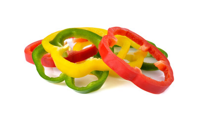 sliced red yellow green bell pepper on white background