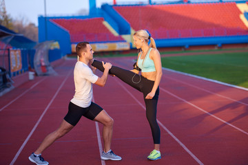 Obraz premium sporty woman on athletic race track