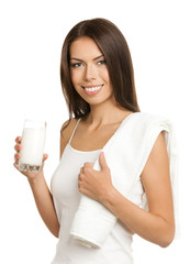 Smiling brunette woman drinking milk, isolated