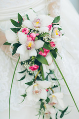 Beautiful wedding bouquet in hands of the bride