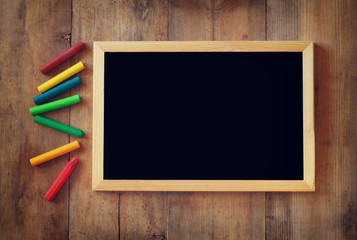 old vintage wooden blackboard on wooden table 