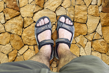 Black sandals on the road
