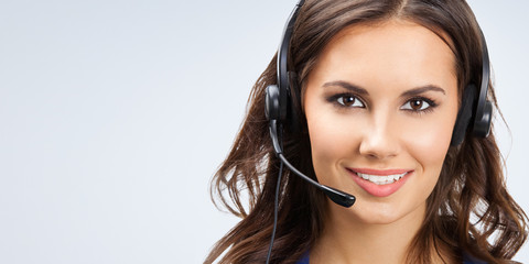 Portrait of happy smiling young support phone operator