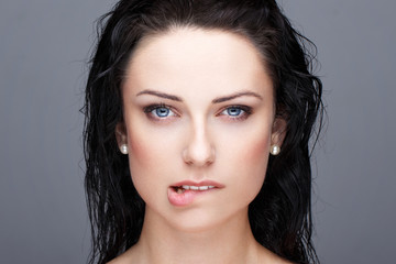 Sexy brunette woman bite lips portrait