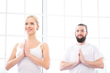 Fototapeta premium Yoga concept with young woman and man