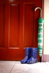 Umbrella and rubber or rain boots by the door