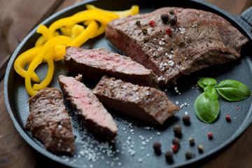 Sliced medium grilled beef barbecue steak, selective focus