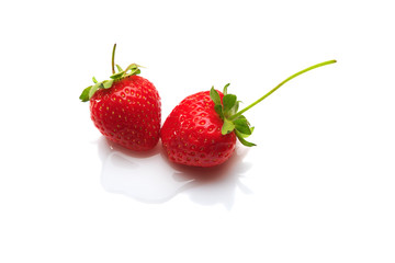 Strawberries in water drops isolated on white background