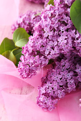 Beautiful lilac flowers on pink background