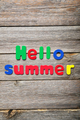 Hello summer words made of colorful magnets