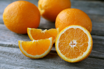 Fresh orange fruit on grey wooden background