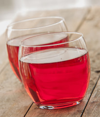 Cold strawberry drink close up in wooden backgrounds