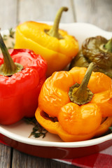 Red and yellow peppers stuffed with meat, rice and vegetables
