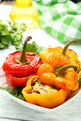 Red and yellow peppers stuffed with meat, rice and vegetables
