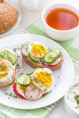 buns with boiled egg and fresh vegetables