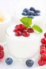 dietary product - assortment yogurt with fresh berries in glass